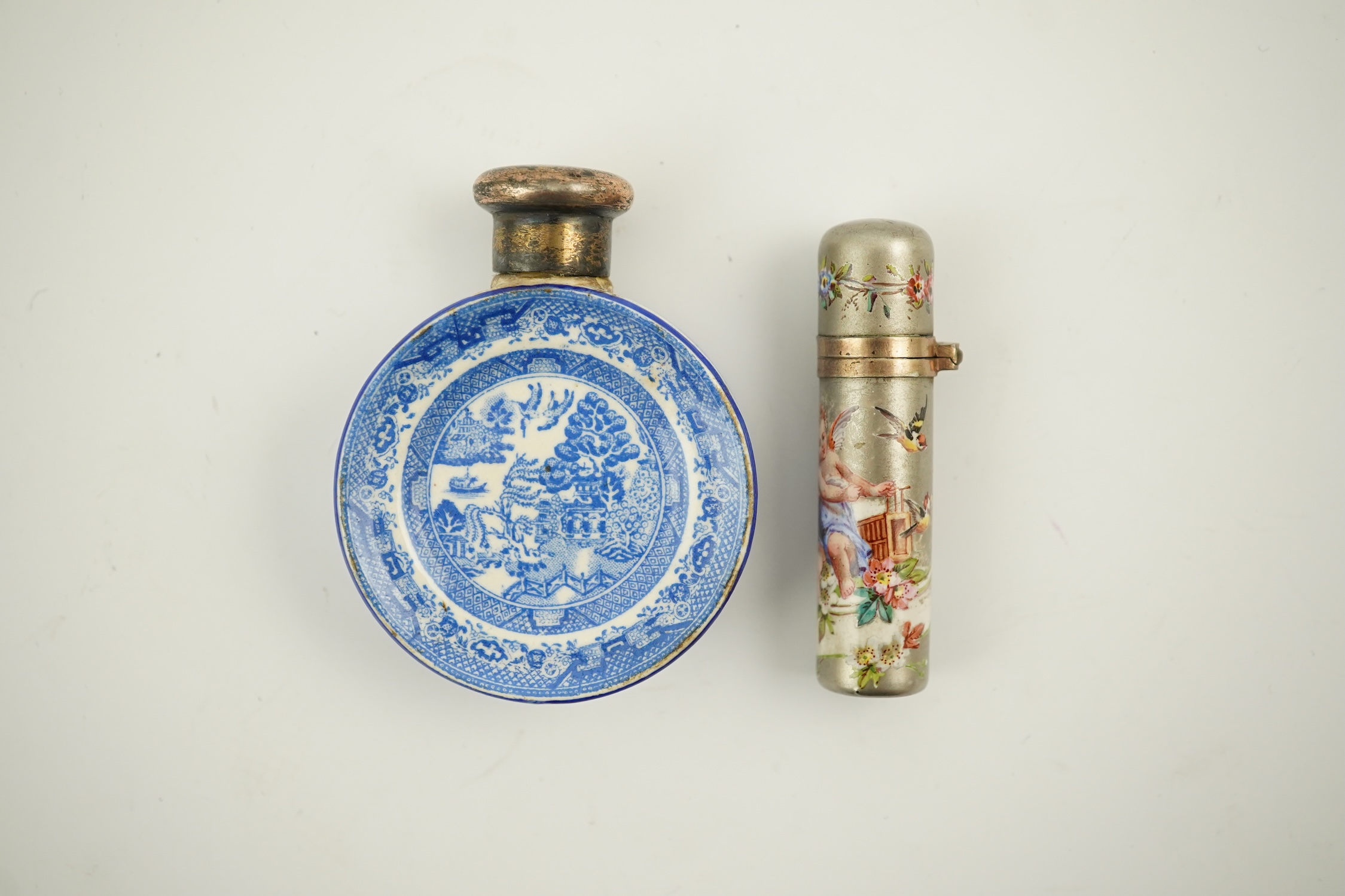 A Victorian white metal and enamel cylindrical scent bottle, 48mm (a.f.) and a late Victorian silver mounted willow pattern scent flask. Condition - poor to fair